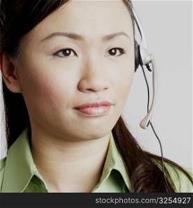 Close-up of a female customer service representative looking away and thinking