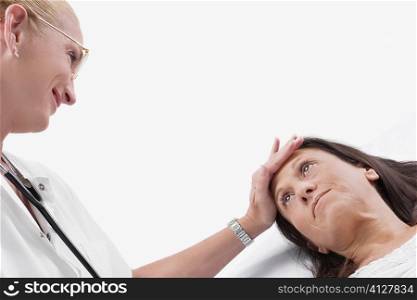 Close-up of a female doctor examining a mature woman
