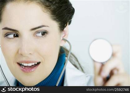 Close-up of a female doctor holding a stethoscope