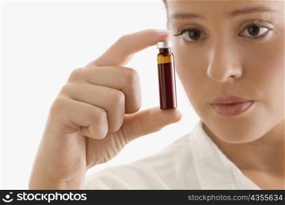 Close-up of a female doctor holding a vial
