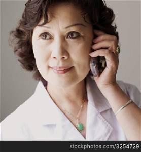 Close-up of a female doctor talking on a mobile phone