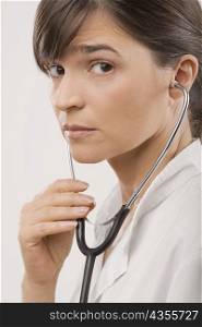 Close-up of a female doctor wearing a stethoscope