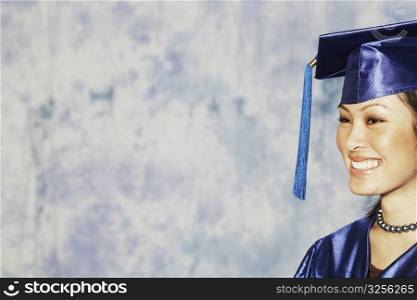 Close-up of a female graduate smiling