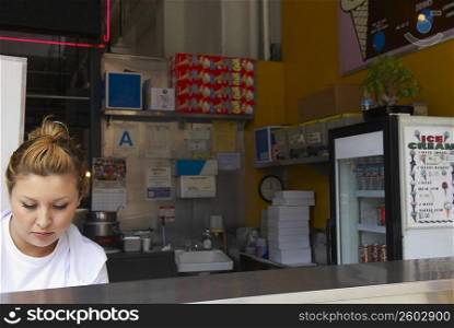 Close-up of a female ice-cream shop owner