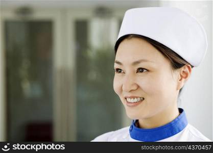 Close-up of a female nurse smiling
