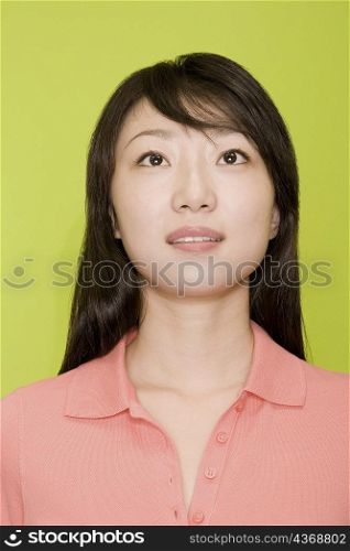 Close-up of a female office worker looking up