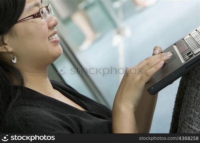 Close-up of a female office worker using a laptop