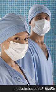 Close-up of a female surgeon and a male surgeon