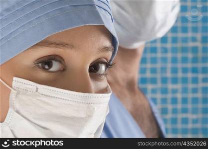 Close-up of a female surgeon wearing a surgical mask