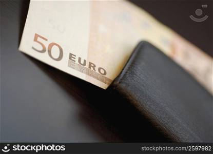Close-up of a fifty Euro dollar in a wallet
