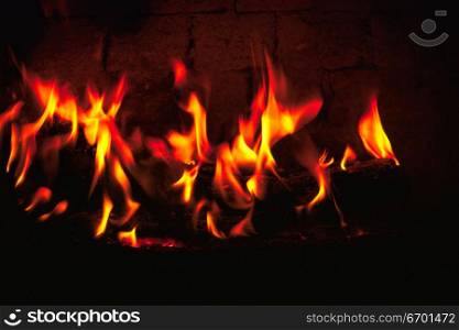 Close-up of a fire lit in a fireplace