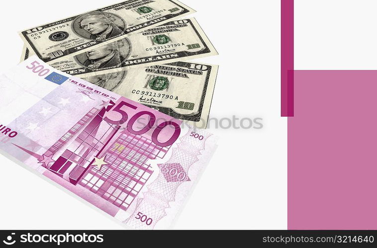 Close-up of a five hundred Euro bank note and American ten dollar bills