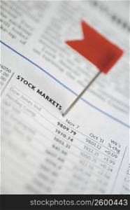 Close-up of a flag and stock market data