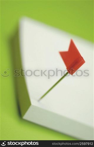 Close-up of a flag on an adhesive note