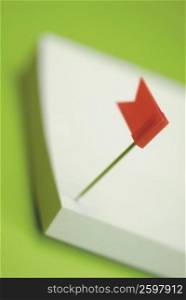 Close-up of a flag on an adhesive note