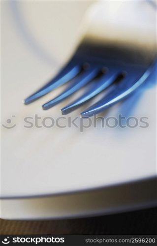 Close-up of a fork on a plate