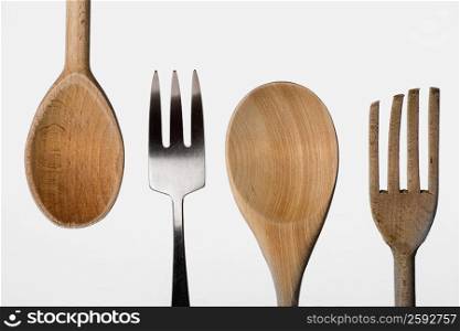 Close-up of a fork with a wooden spoon