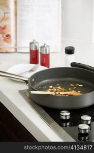 Close-up of a frying pan on a stove in the kitchen