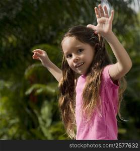 Close-up of a girl dancing in a park