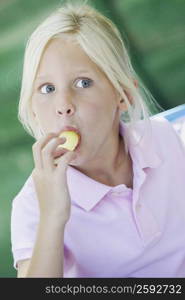 Close-up of a girl eating an ice-cream