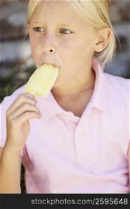 Close-up of a girl eating an ice-cream