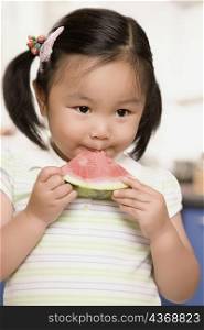 Close-up of a girl eating watermelon
