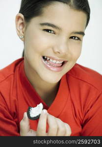 Close-up of a girl holding a cookie