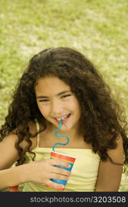 Close-up of a girl holding a disposable cup