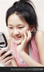 Close-up of a girl holding a mobile phone
