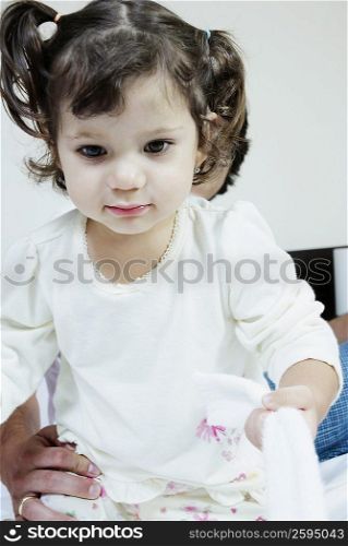 Close-up of a girl holding a towel
