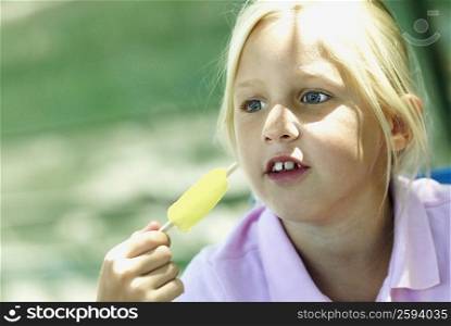 Close-up of a girl holding an ice-cream