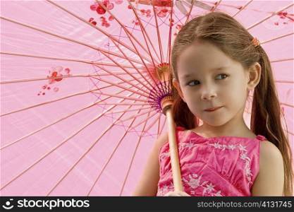 Close-up of a girl holding an umbrella