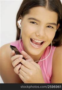 Close-up of a girl listening to an MP3 player