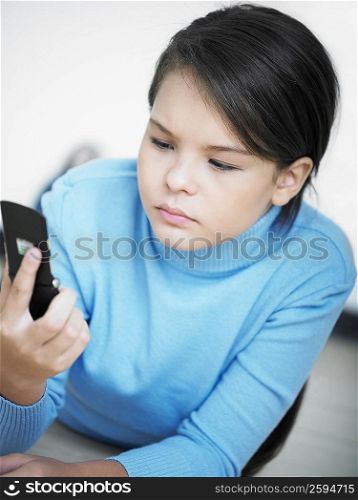 Close-up of a girl looking at a mobile phone