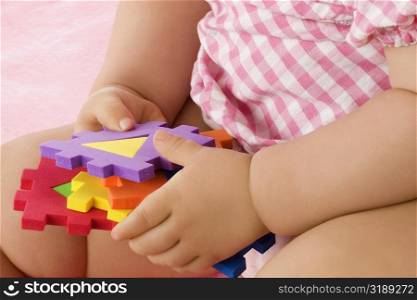 Close-up of a girl playing with toys