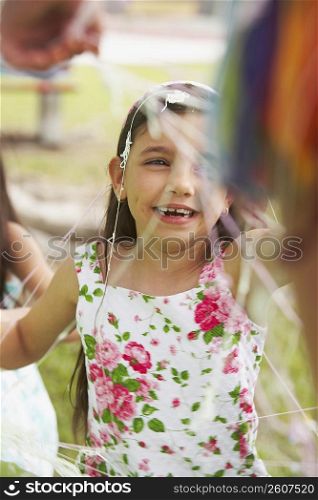 Close-up of a girl smiling at a birthday party