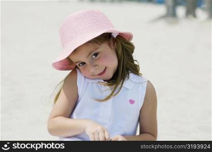 Close-up of a girl smiling on the beach