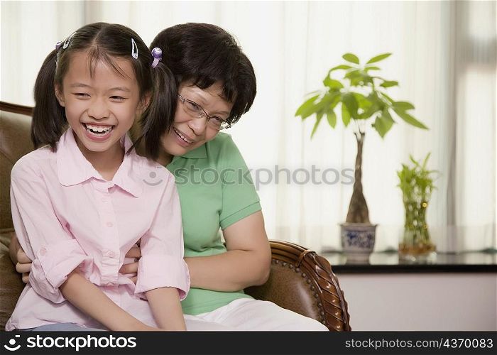 Close-up of a girl smiling with her grandmother