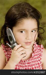 Close-up of a girl talking on a mobile phone