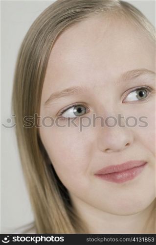 Close-up of a girl thinking and looking sideways