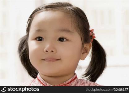 Close-up of a girl thinking and smiling
