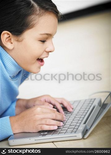Close-up of a girl using a laptop