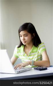 Close-up of a girl using a laptop