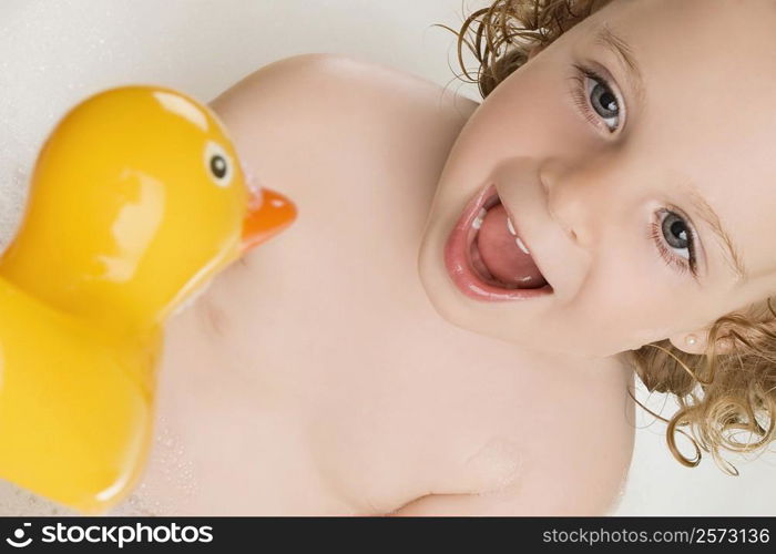 Close-up of a girl with a rubber duck