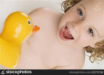 Close-up of a girl with a rubber duck