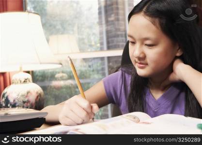 Close-up of a girl writing