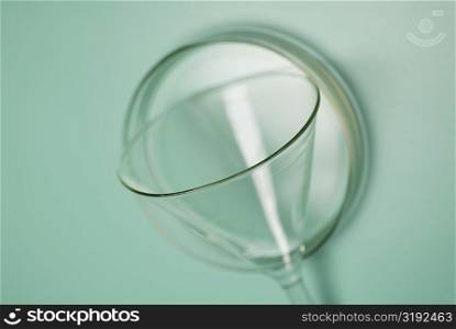 Close-up of a glass funnel with a petri dish