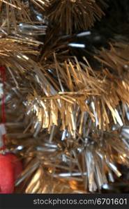 Close-up of a gold and silver artificial Christmas tree