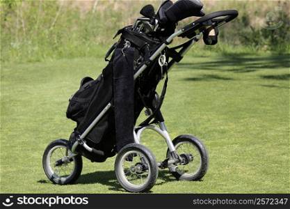 Close-up of a golf bag on a trolley