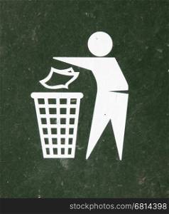 Close-up of a green bin, icon of man trowing something in bin